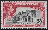 1944 Gibraltar  SG.129b   5/-  black and carmine  perf 13  U/M (MNH)