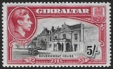 1938 Gibraltar  SG.129   5/- black and carmine perf 14  very lightly mounted.